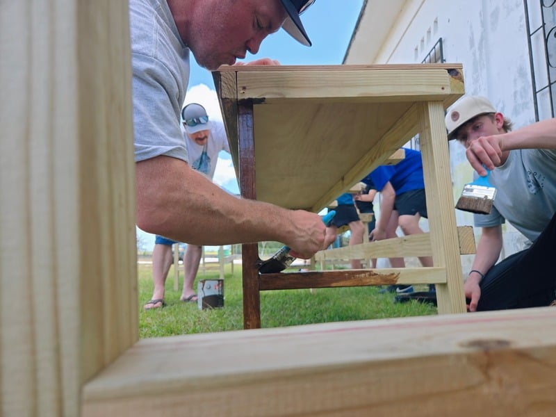 A team building the school's new awning