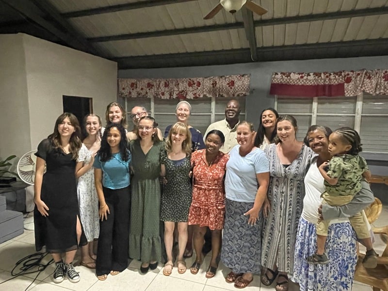The team gathered indoors with local church members for an evening of fellowship