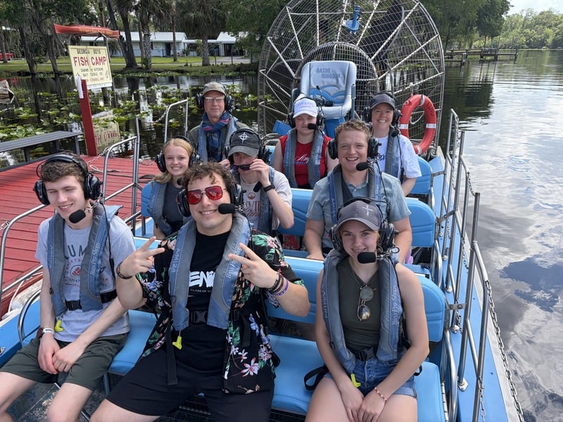 A team on a gator airboat tour