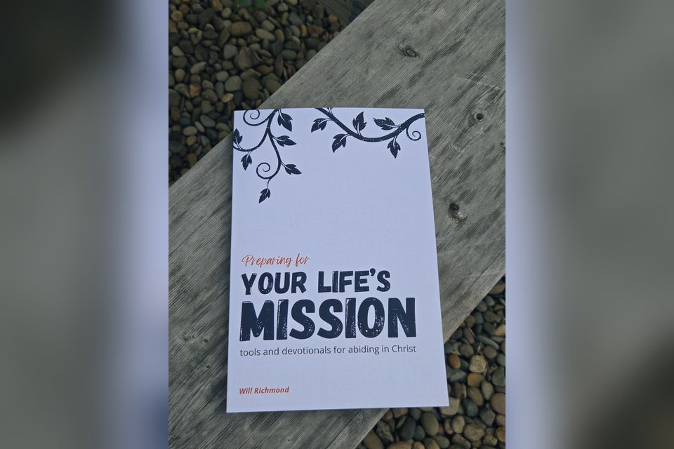 The front cover of the Preparing for Your Life&rsquo;s Mission book on a wooden bench