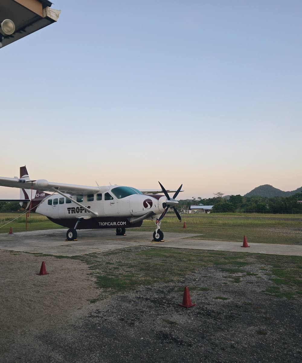 A small plane on the airstrip at dawn, ready for departure
